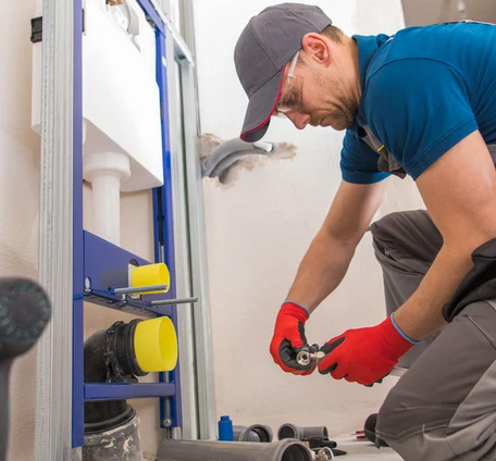 Professional plumber working